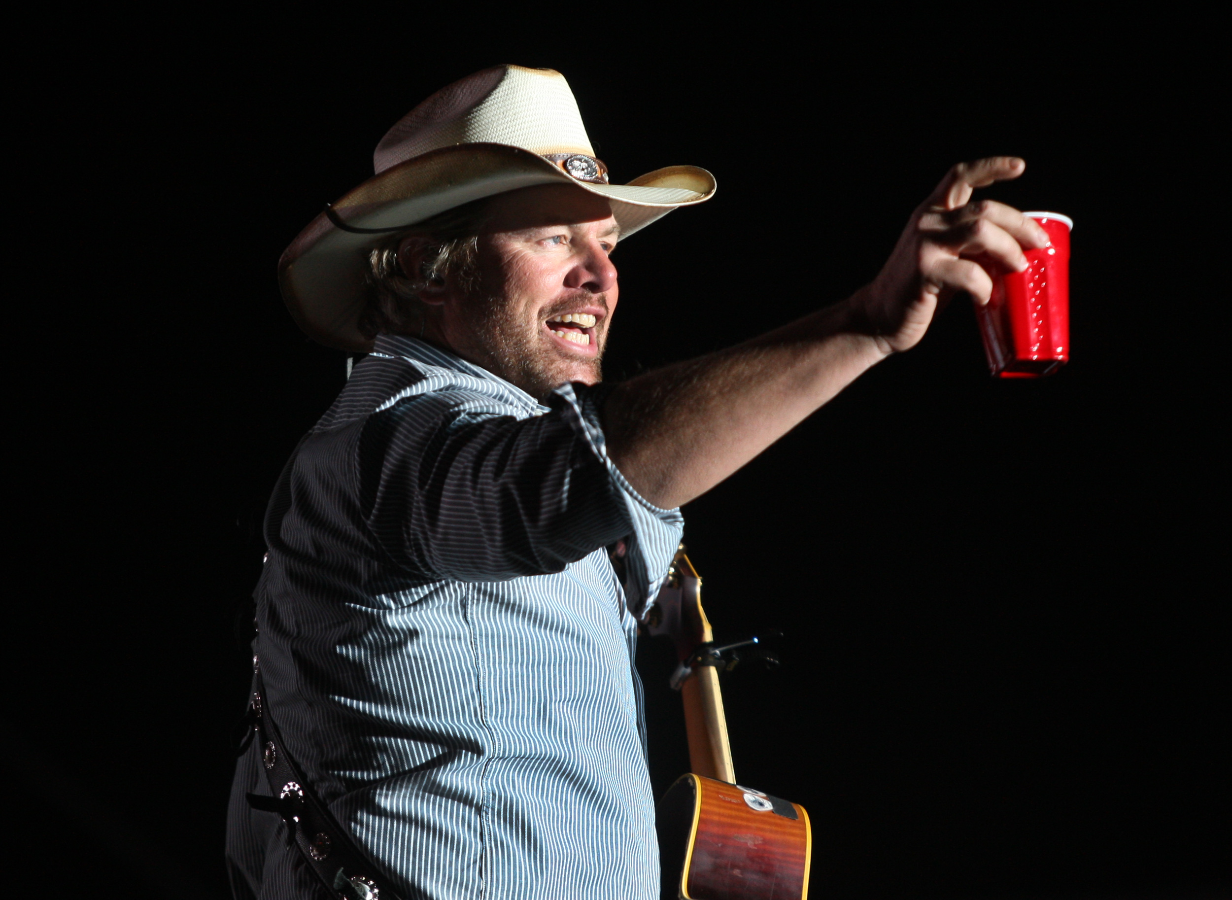 Toby Keith toasts his fans with a red solo cup, the name of one of his hit songs on the Mane Stage during the first day of the Stagecoach Country Music Festival at the Indio Polo Fields on the first day, Friday, April 26, 2013.
