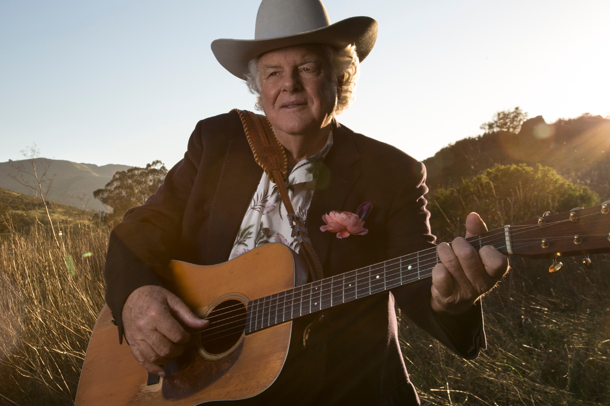 Peter Rowan poses with guitar