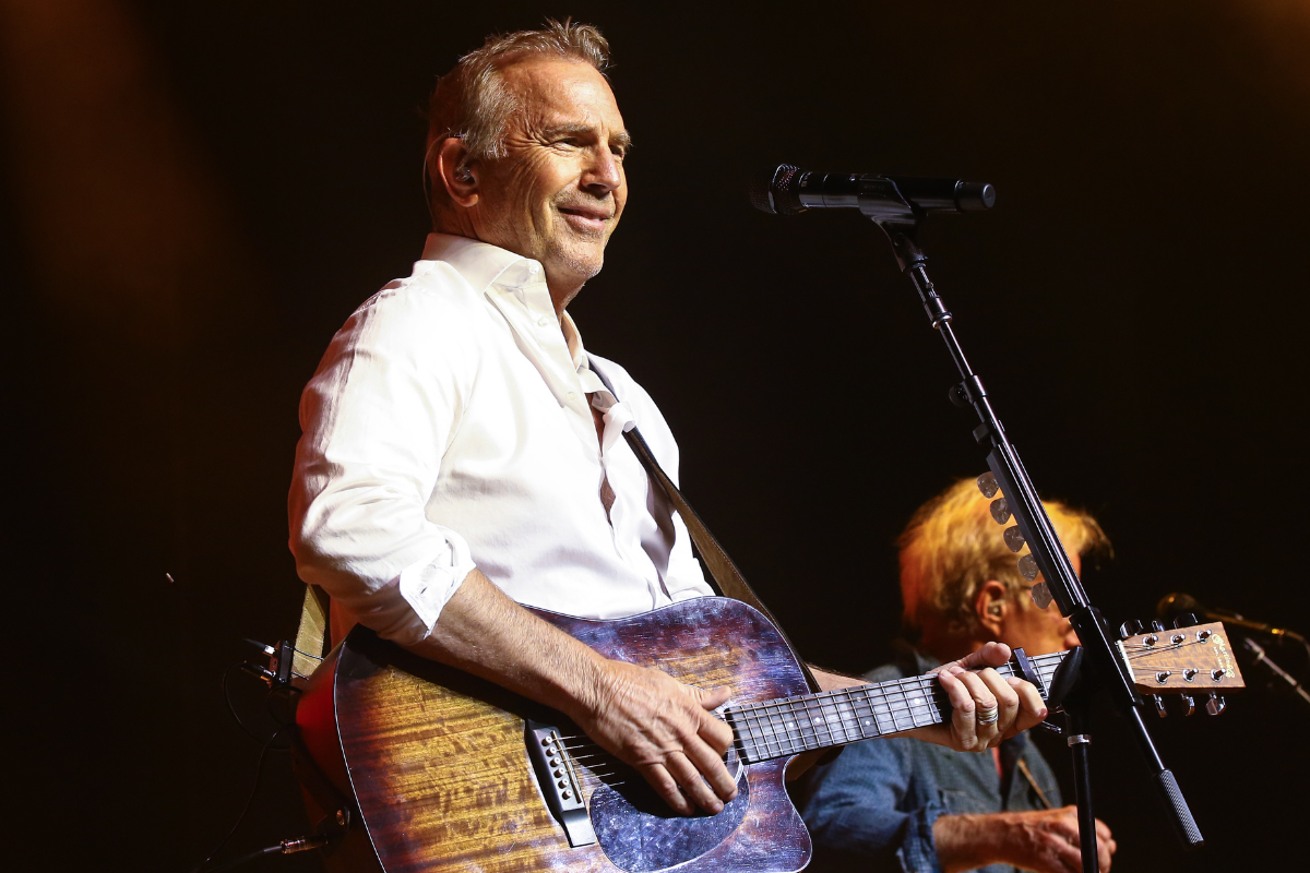 Kevin Costner performs with his band Modern West on stage at Ryman Auditorium on October 26, 2021 in Nashville, Tennessee.