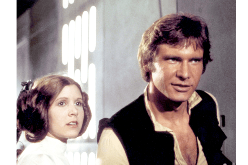 Carrie Fisher and Harrison Ford on the set of Star Wars: Episode IV - A New Hope written, directed and produced by Georges Lucas