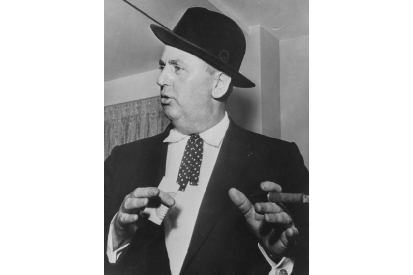 Colonel Tom Parker, Manager of musician Elvis Presley, pictured smoking a cigar, circa 1955
