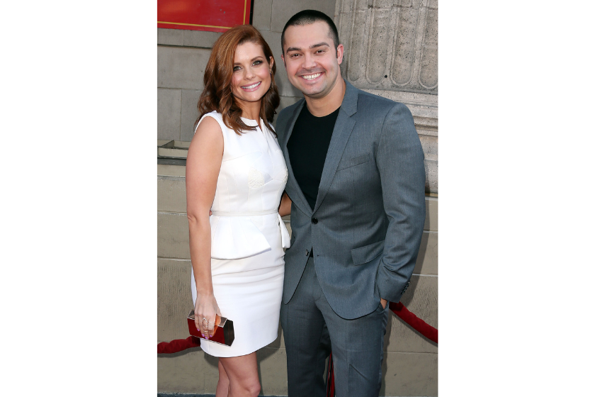 Actress JoAnna Garcia Swisher (L) and professional baseball player Nick Swisher attends the Screening of ABC's "Once Upon A Time" Season 4 at the El Capitan Theatre on September 21, 2014 in Hollywood, California
