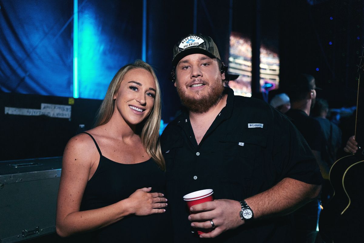 Nicole Hocking and Luke Combs attend day 3 of The 49th CMA Fest at Nissan Stadium on June 11, 2022 in Nashville, Tennessee.