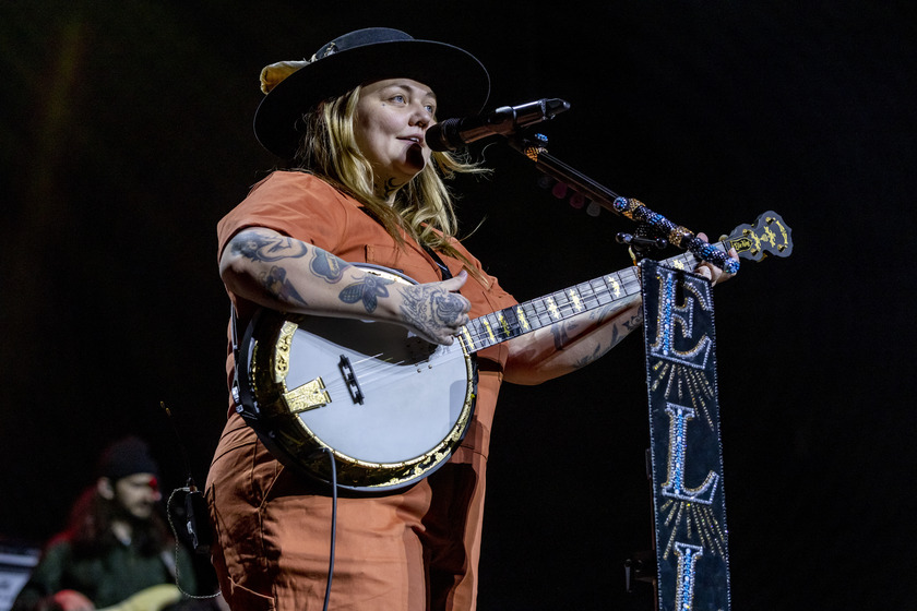 Elle King plays banjo onstage