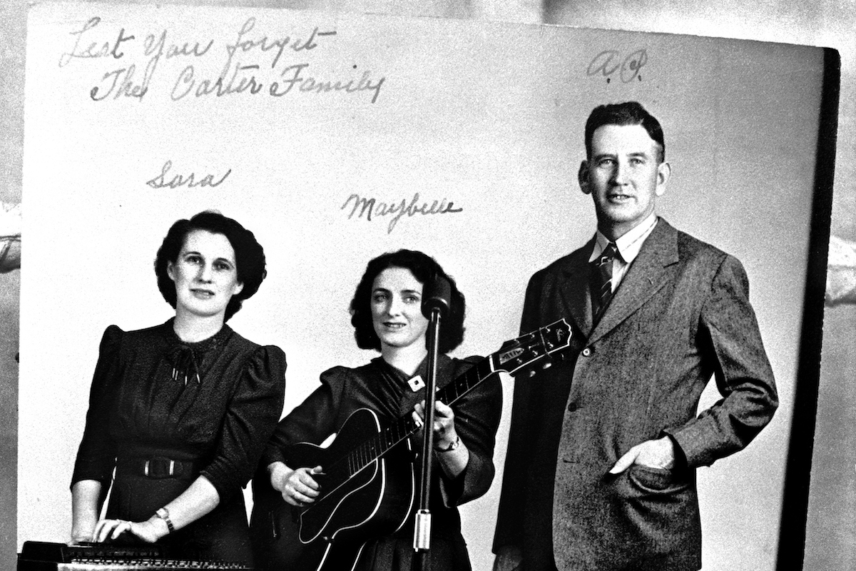 MACES SPRING, VA - JULY, 1972: A photograph of the pioneering musical group, The Carter Family, is on display at the Carter Family Museum near the musicians' birthplaces and homes in rural Maces Spring in Southwest Virginia. The Carter Family was a traditional American folk music group that recorded between 1927 and 1956. Their music had a profound impact on what would become known in later years as country and bluegrass music. The group consisted of Alvin Pleasant "A.P." Carter, his wife, Sara Carter, and his sister-in-law, Maybelle Carter.