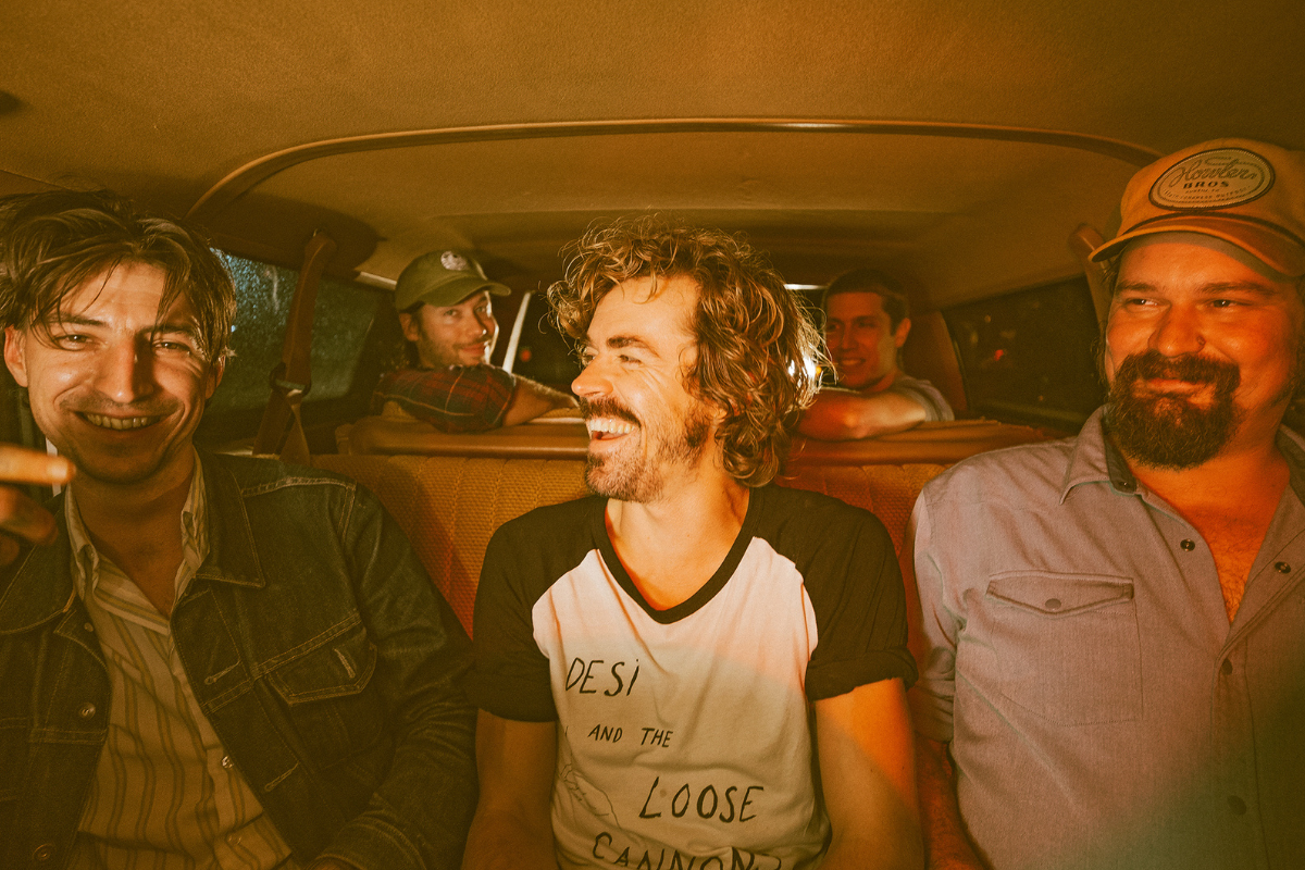 Country band Deslondes pose in van