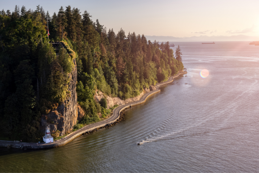 Aerial View from Lions Gate Bridge of Famous Seawall in Stanley Park. Sunny Summer Sunset. Downtown Vancouver, British Columbia, Canada.