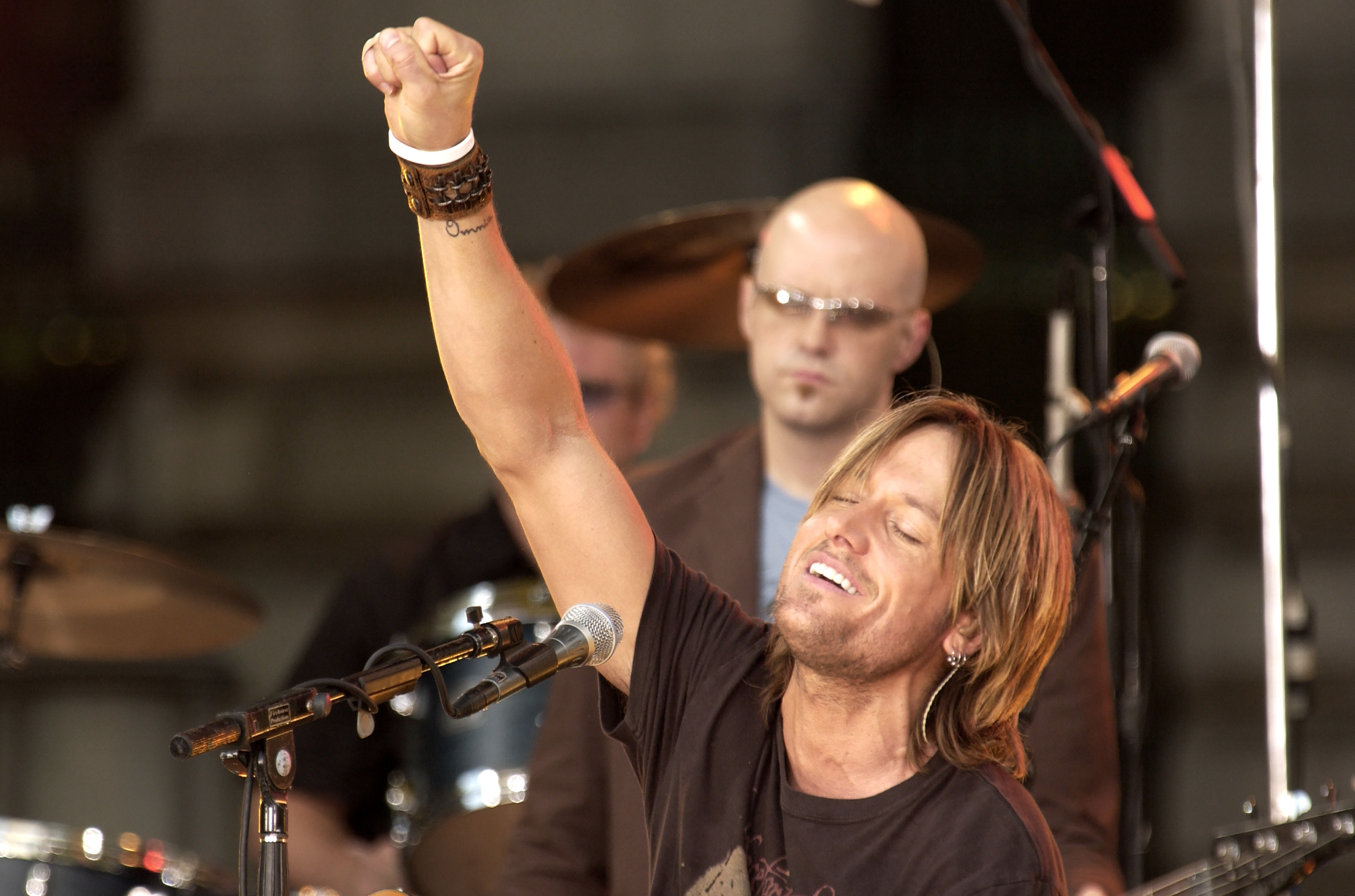 New Zealander-Australian Country and Pop musician Keith Urban plays acoustic guitar as he performs onstage during ABC Television's 'Good Morning America' at Rumsey Playfield, Central Park, New York, New York, August 12, 2005. 