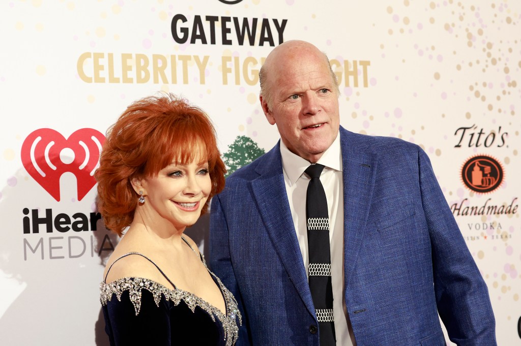 PHOENIX, ARIZONA - MARCH 12: Reba McEntire and Rex Linn arrive to The Inaugural Gateway Celebrity Fight Night held at JW Marriott Phoenix Desert Ridge Resort & Spa on March 12, 2022 in Phoenix, Arizona.