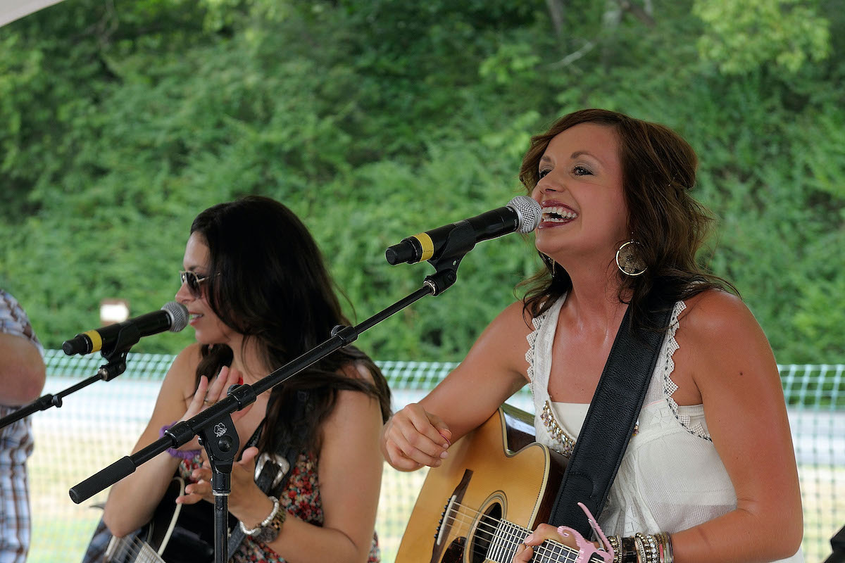 NASHVILLE, TN - JULY 08: Rose Falcon and Carly Pearce perform during the 2012 Country Throwdown tour closer at The Woods at Fontanel on July 8, 2012 in Nashville, Tennessee.
