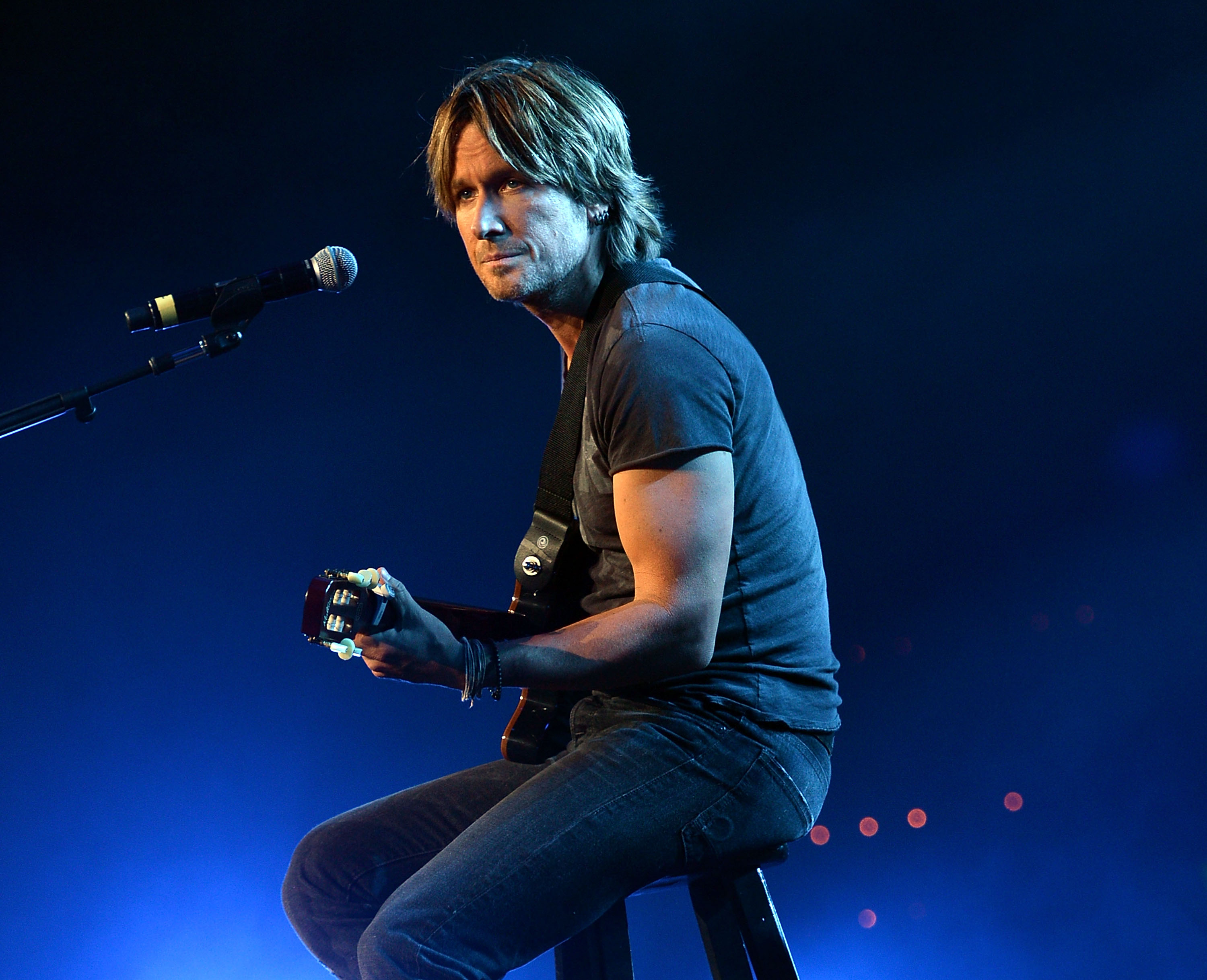 NASHVILLE, TN - APRIL 16: Keith Urban performs during Keith Urban's Fourth annual We're All For The Hall benefit concert at Bridgestone Arena on April 16, 2013 in Nashville, Tennessee.