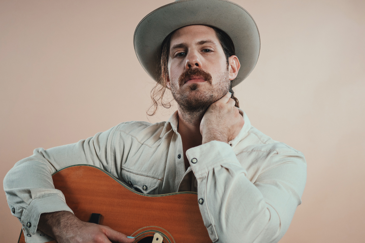 Michael Paul Lawson poses with guitar