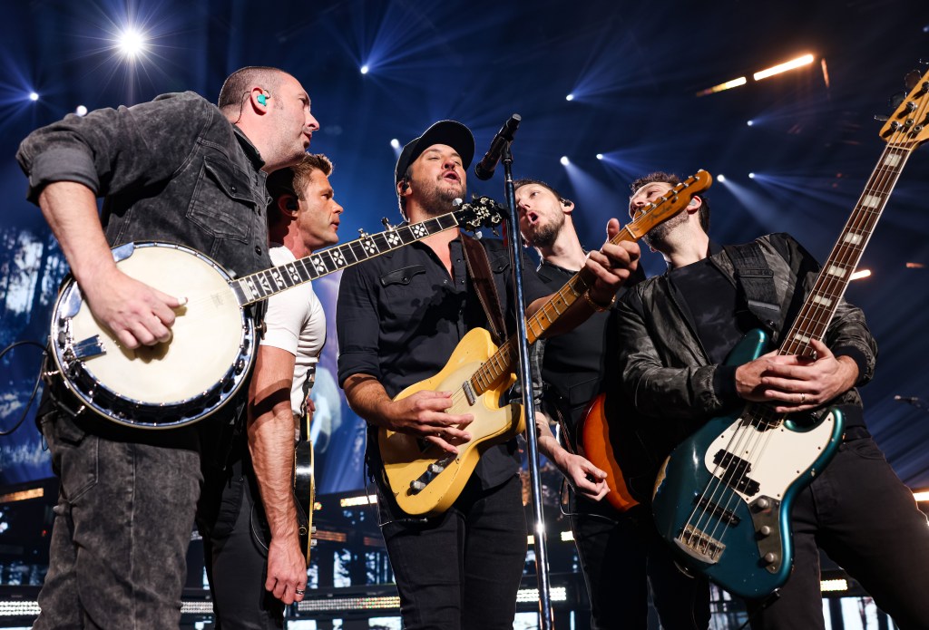 Luke Bryan (C) performs during the opening night of his residency at Resorts World Las Vegas on February 11, 2022 in Las Vegas, Nevada. 