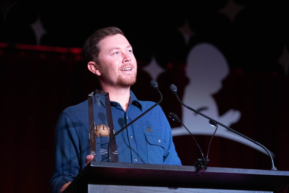 Press photo of Scotty McCreery (center) from the 2022 Country Cares Seminar.
