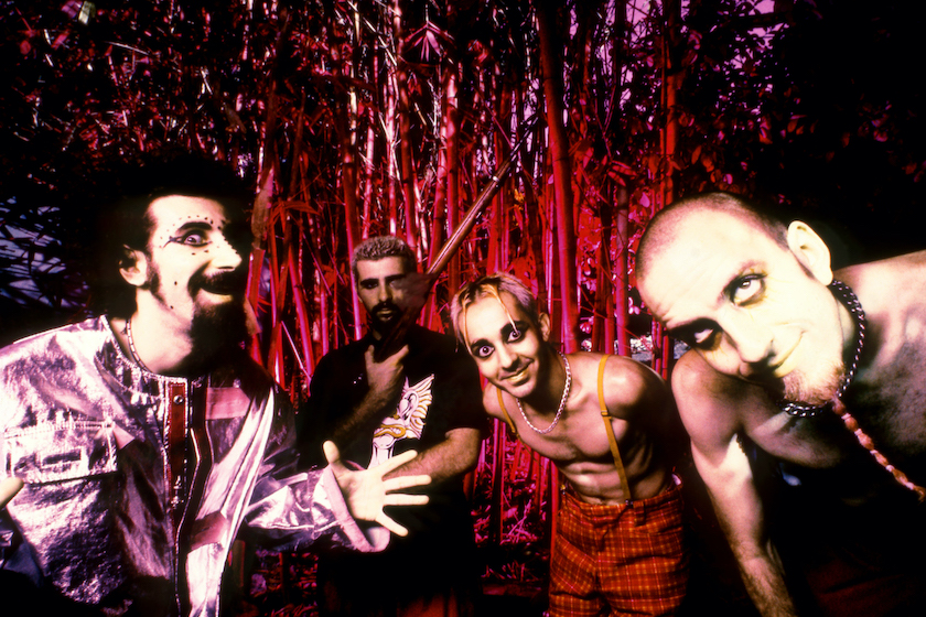 LOS ANGELES, CA - SEPTEMBER, 1998: Armenian-American singer, musician, songwriter, record producer, and political activist Serj Tankian, Armenian-American drummer and songwriter John Dolmayan, Armenian-American musician, singer, songwriter, and record producer Daron Malakian and Armenian-American musician and songwriter Shavo Odadjian, of the Armenian-American heavy metal band System of a Down, pose for a group portrait circa September, 1998 in Los Angeles, California. 