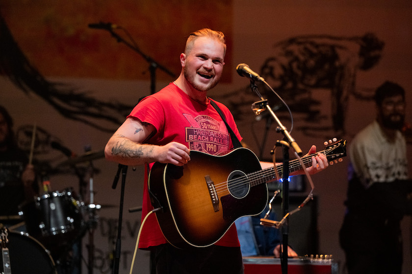 LOS ANGELES, CALIFORNIA - OCTOBER 18: Musician Zach Bryan performs onstage during the 'American Heartbreak' tour at The Wiltern on October 18, 2022 in Los Angeles, California. 