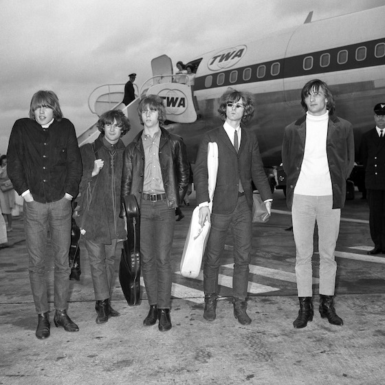 American pop group The Byrds at London Airport, where they flew in for a 16-day tour. (l-r) Mike Clarke, Chris Hillman, David Crosby, Jim McGuinn and Gene Clark. 