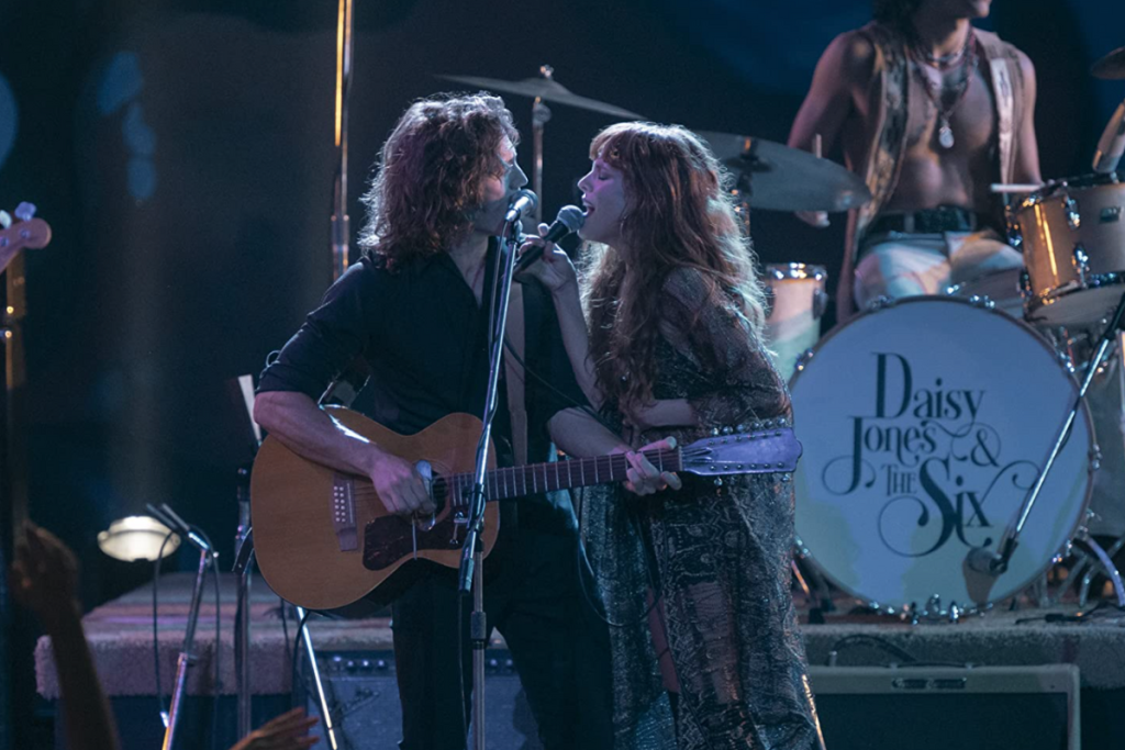 Riley Keough and Sam Claflin in Daisy Jones & The Six (2023)