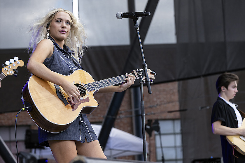 CHARLOTTE, NORTH CAROLINA - AUGUST 27: Singer and guitarist Megan Moroney performs at Charlotte Metro Credit Union Amphitheatre on August 27, 2022 in Charlotte, North Carolina. 