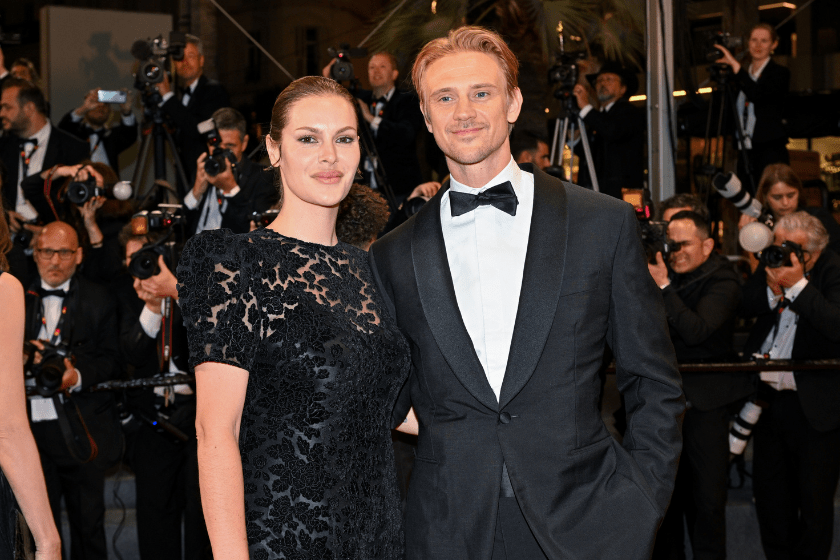 Tatiana Pajkovic and Boyd Holbrook depart the "Indiana Jones And The Dial Of Destiny" red carpet during the 76th annual Cannes film festival at Palais des Festivals on May 18, 2023 in Cannes, France