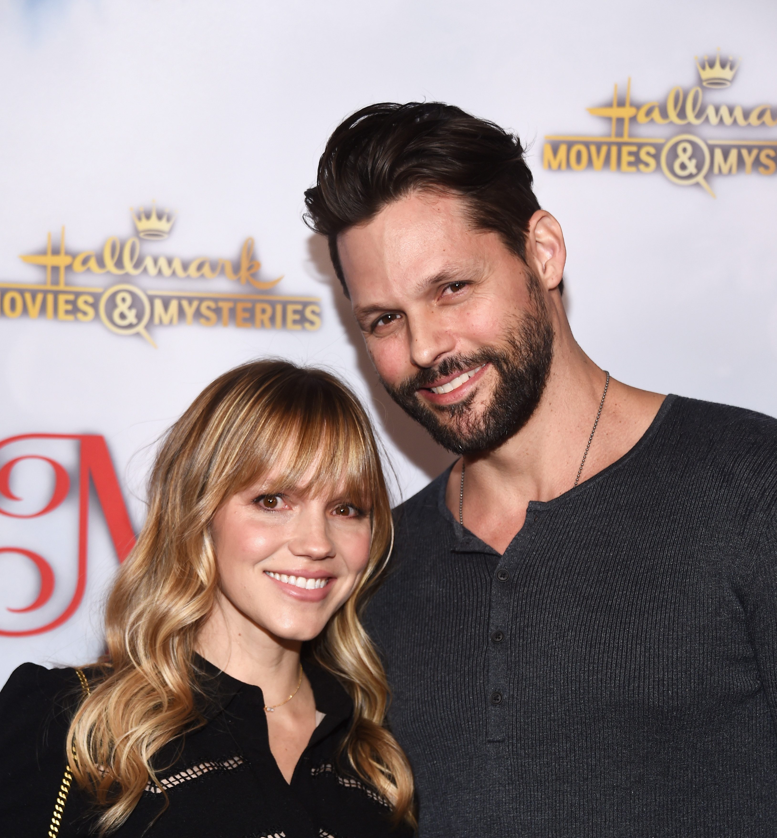 LOS ANGELES, CA - DECEMBER 04:  Actor Justin Bruening (R) and actress Alexa Havins arrive at the Hallmark Channel "Once Upon A Christmas Miracle" screening and holiday party at 189 by Dominique Ansel on December 4, 2018 in Los Angeles, California. 