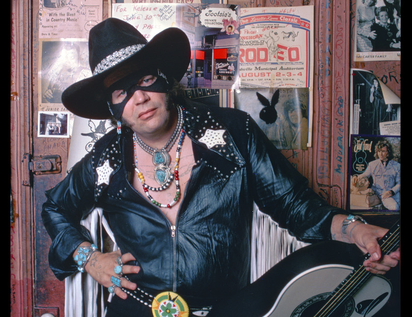 Musician, singer, song writer, entertainer and country music legend, David Allan Coe with guitar dressed as The Mysterious Rhinestone Cowboy for the cover of The New York magazine in August 1975. Photographed waist up at Tootsie's Orchid Lounge, Nashville, Tennessee. Photo is part of the Nashville Music Collection. 