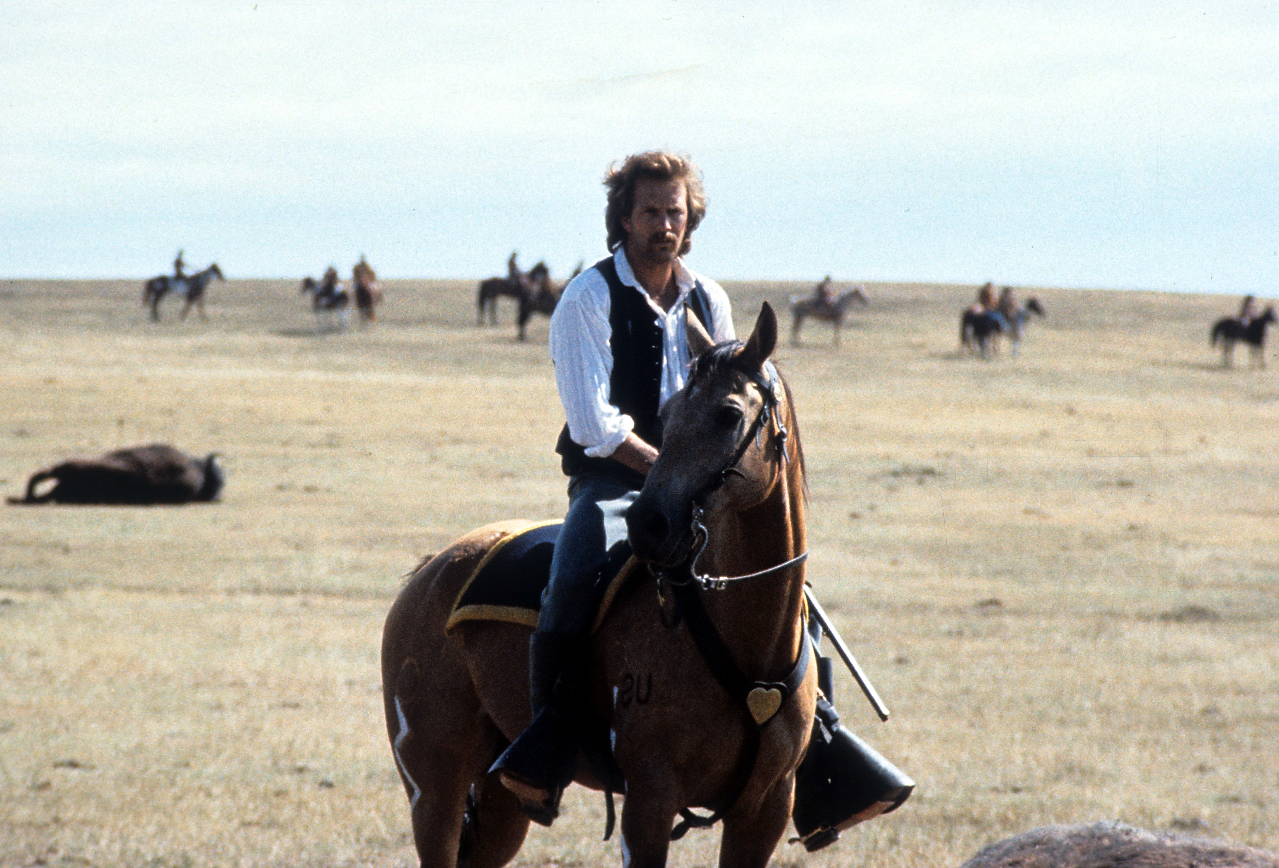 Kevin Costner riding a horse on a wide open plain in a scene from the film 'Dances With Wolves', 1990. 