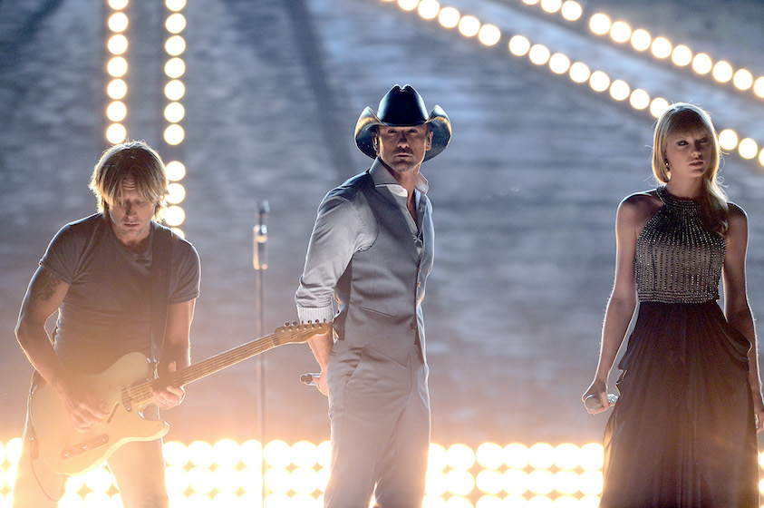 LAS VEGAS, NV - APRIL 07: (L-R) Recording artists Keith Urban, Tim McGraw and Taylor Swift perform onstage during the 48th Annual Academy of Country Music Awards at the MGM Grand Garden Arena on April 7, 2013 in Las Vegas, Nevada. 