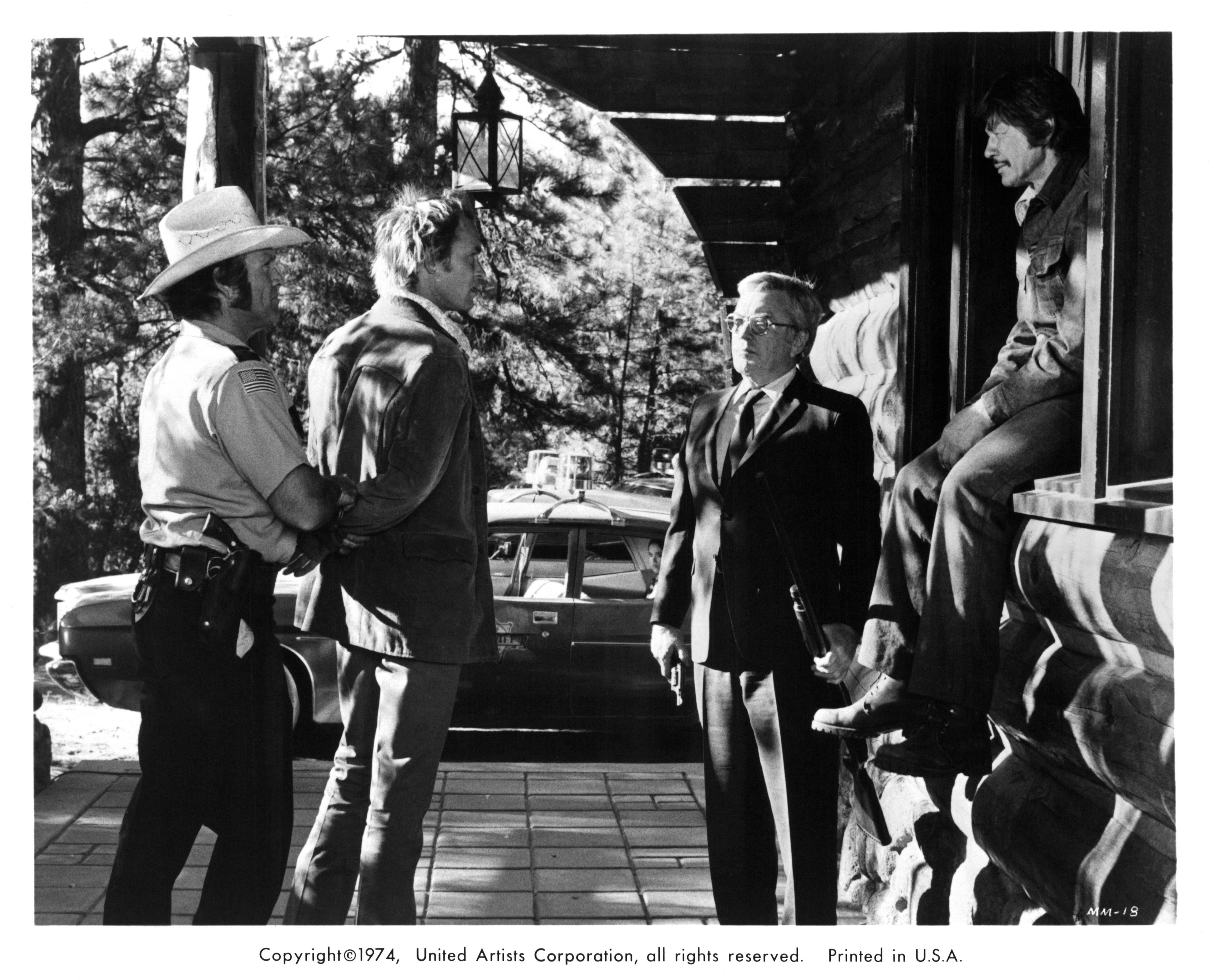 Actor Charles Bronson (R) and Jordan Rhodes (second from left) on set of the United Artist movie "Mr. Majestyk" in 1974.