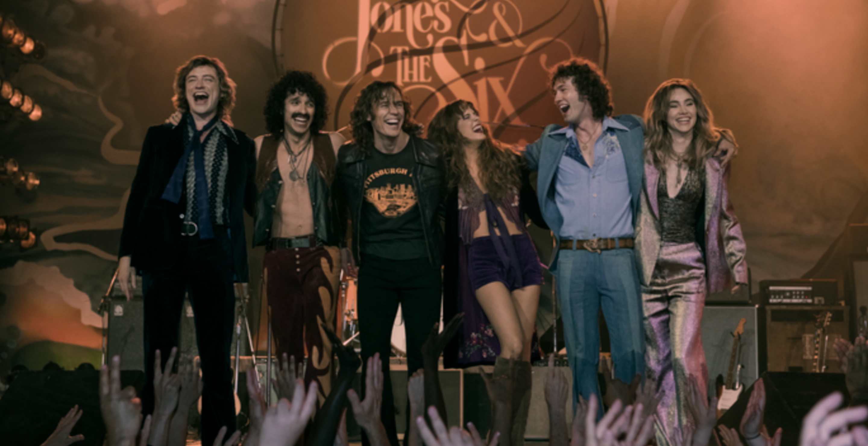 Description: Josh Whitehouse (Eddie Roundtree), Sebastian Chacon (Warren Rojas), Sam Claflin (Billy Dunne), Riley Keough (Daisy Jones), Will Harrison (Graham Dunne), Suki Waterhouse (Karen Sirko)