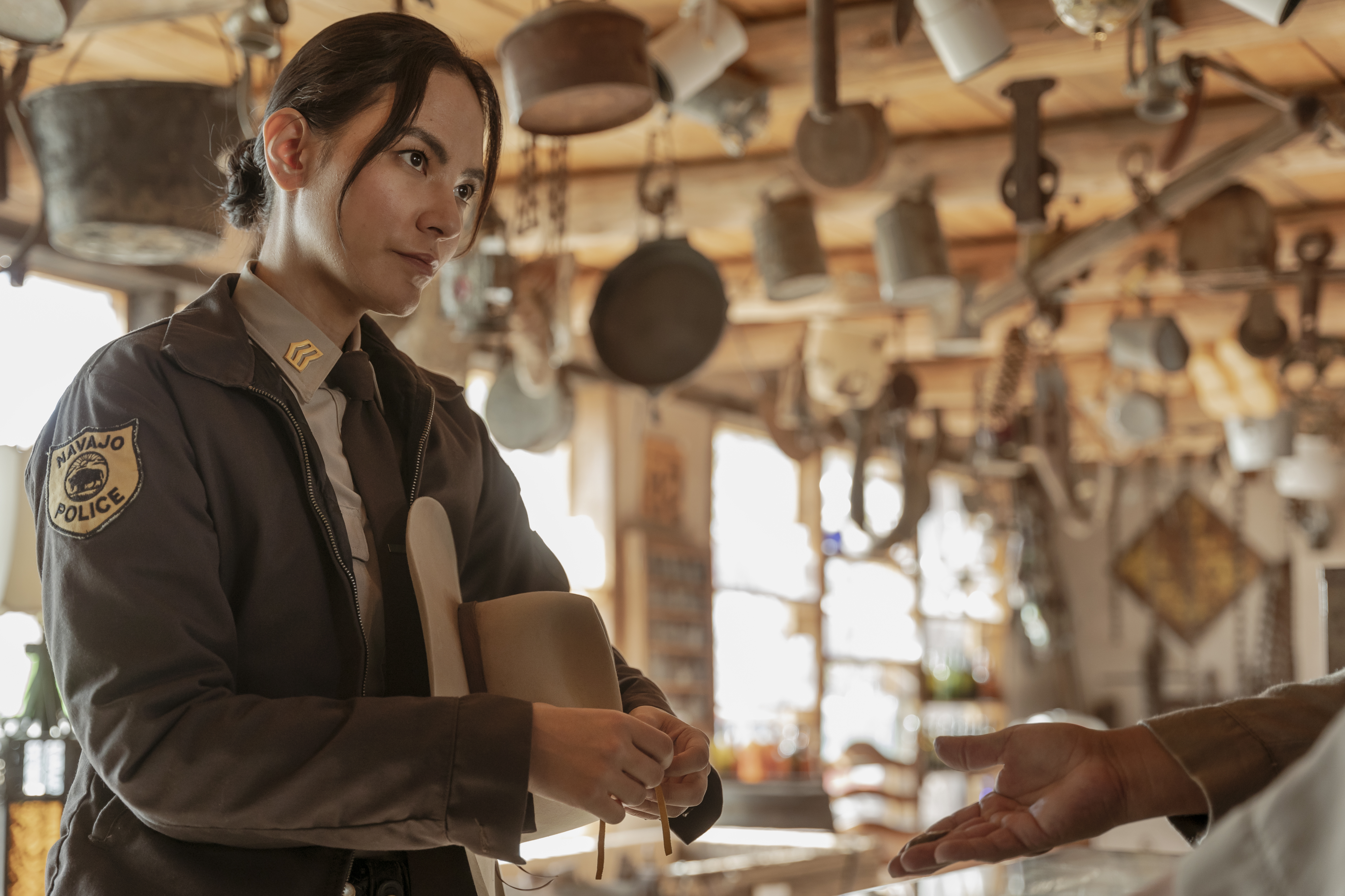 Jessica Matten as Sgt. Bernadette Manuelito and Ernest David Tsosie as Roger - Dark Winds _ Season 2, Episode 2