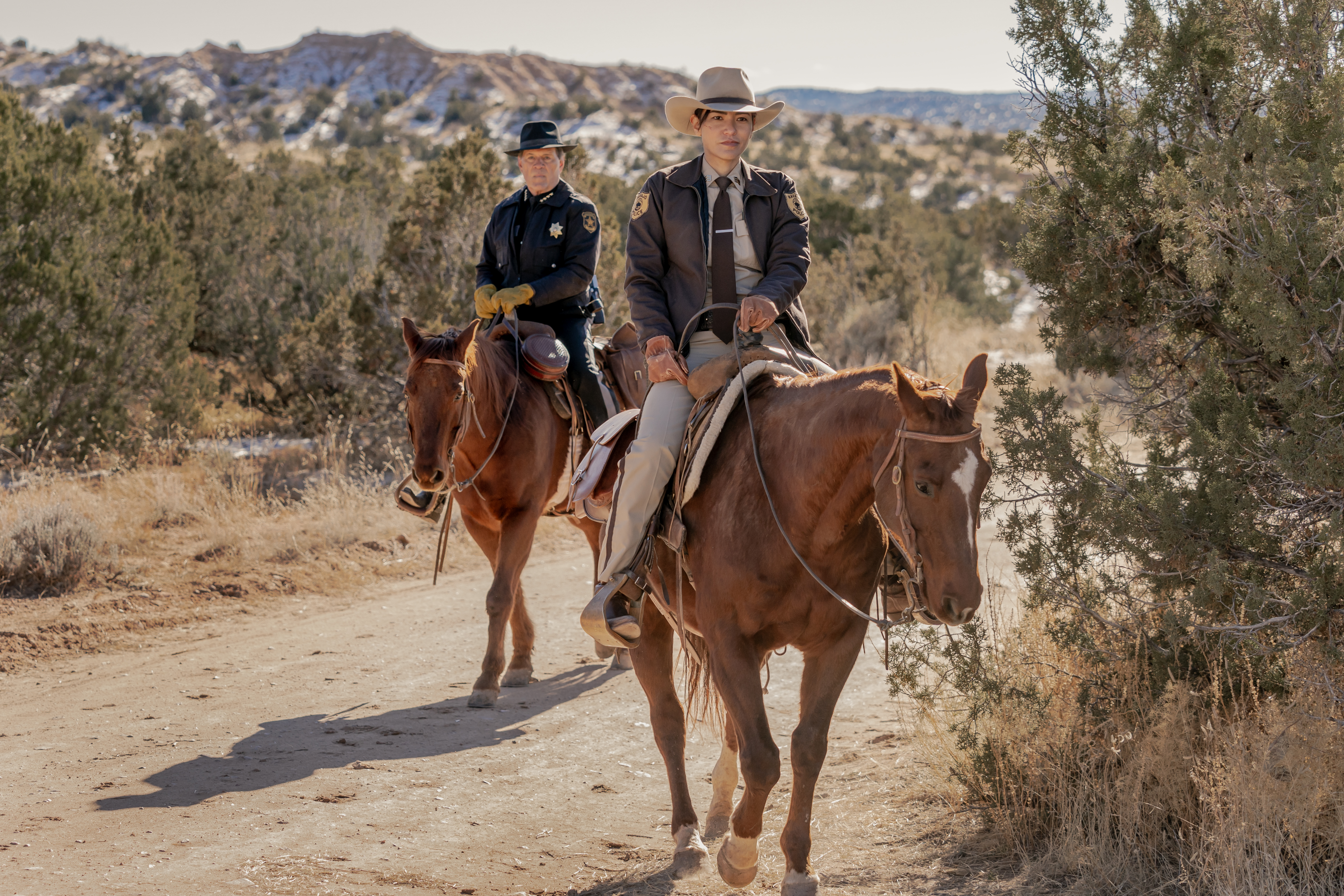 Jessica Matten as Sgt. Bernadette Manuelito and A. Martinez as Gordo Sena - Dark Winds _ Season 2, Episode 4 