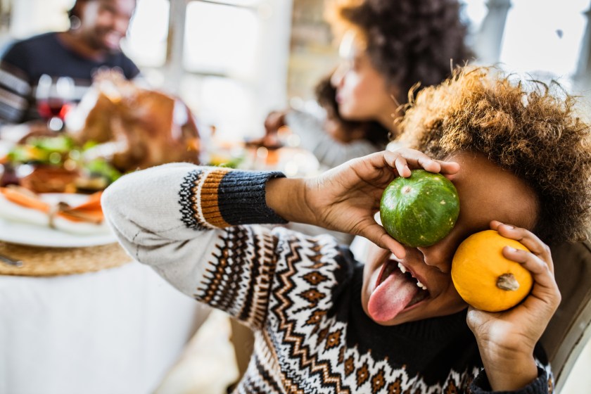 Girl having fun at Thanksgiving dinner