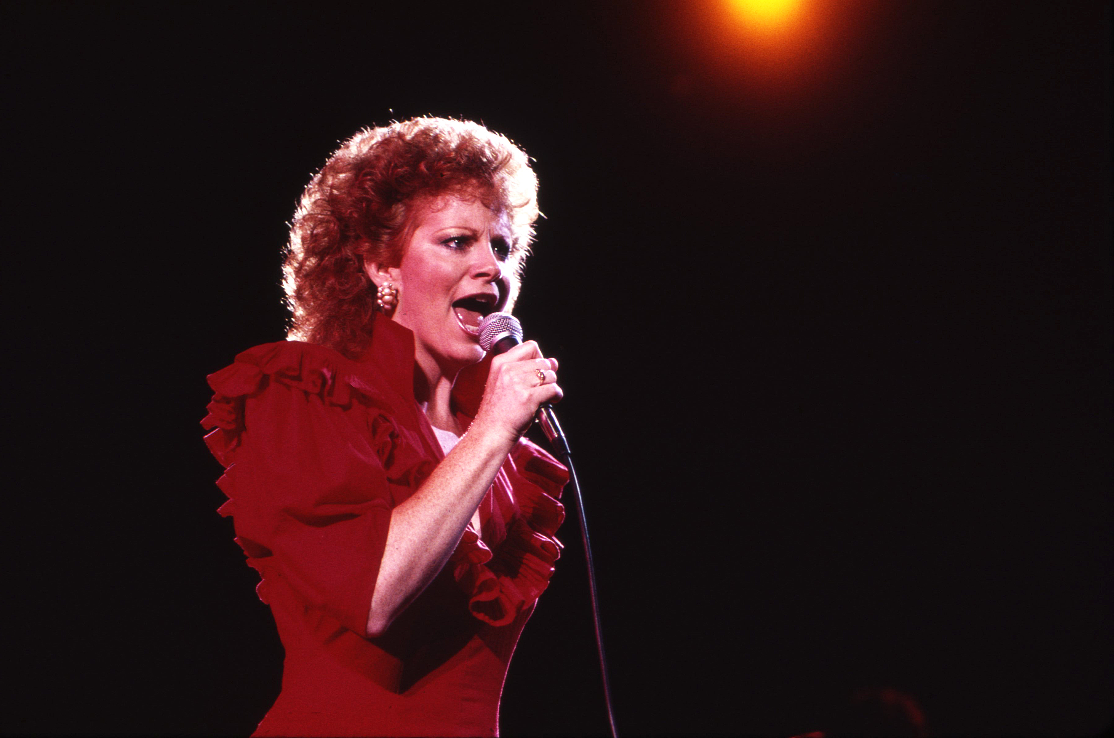 NASHVILLE -June 26: Country Music Singer Songwriter Reba McEntire receives a Music City News Award on June 26, 1987 in Nashville, Tennessee 