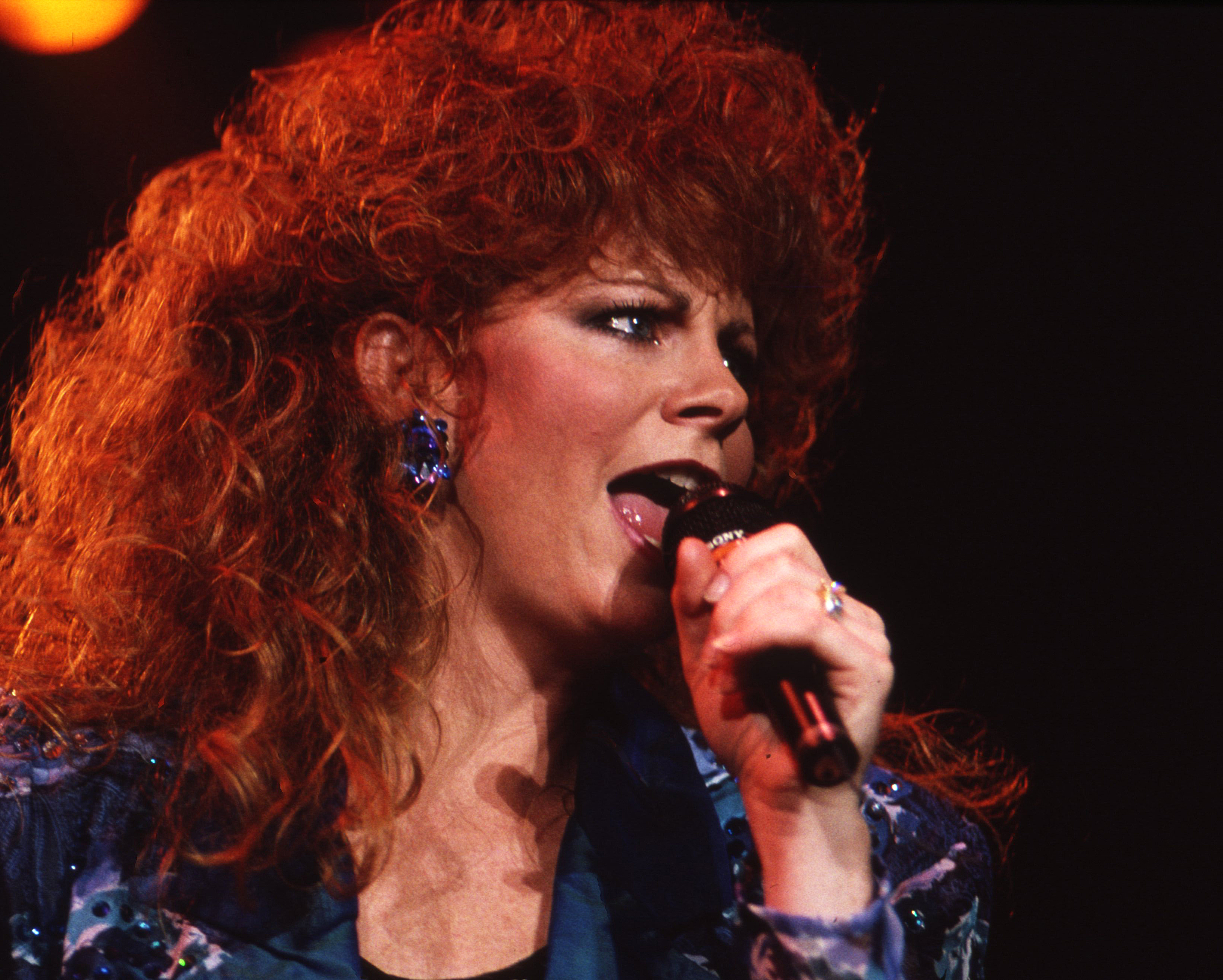 NASHVILLE -August 24: Country Music Singer Songwriter Reba McEntire preforms on August 24, 1990 Nashville, Tennessee
