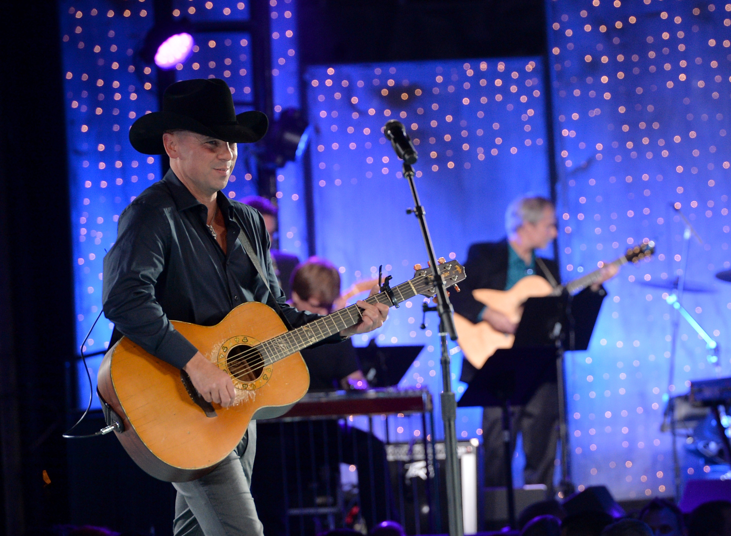 NASHVILLE, TN - NOVEMBER 05: Kenny Chesney performs onstage during the 61st annual BMI Country Awards on November 5, 2013 in Nashville, Tennessee. 