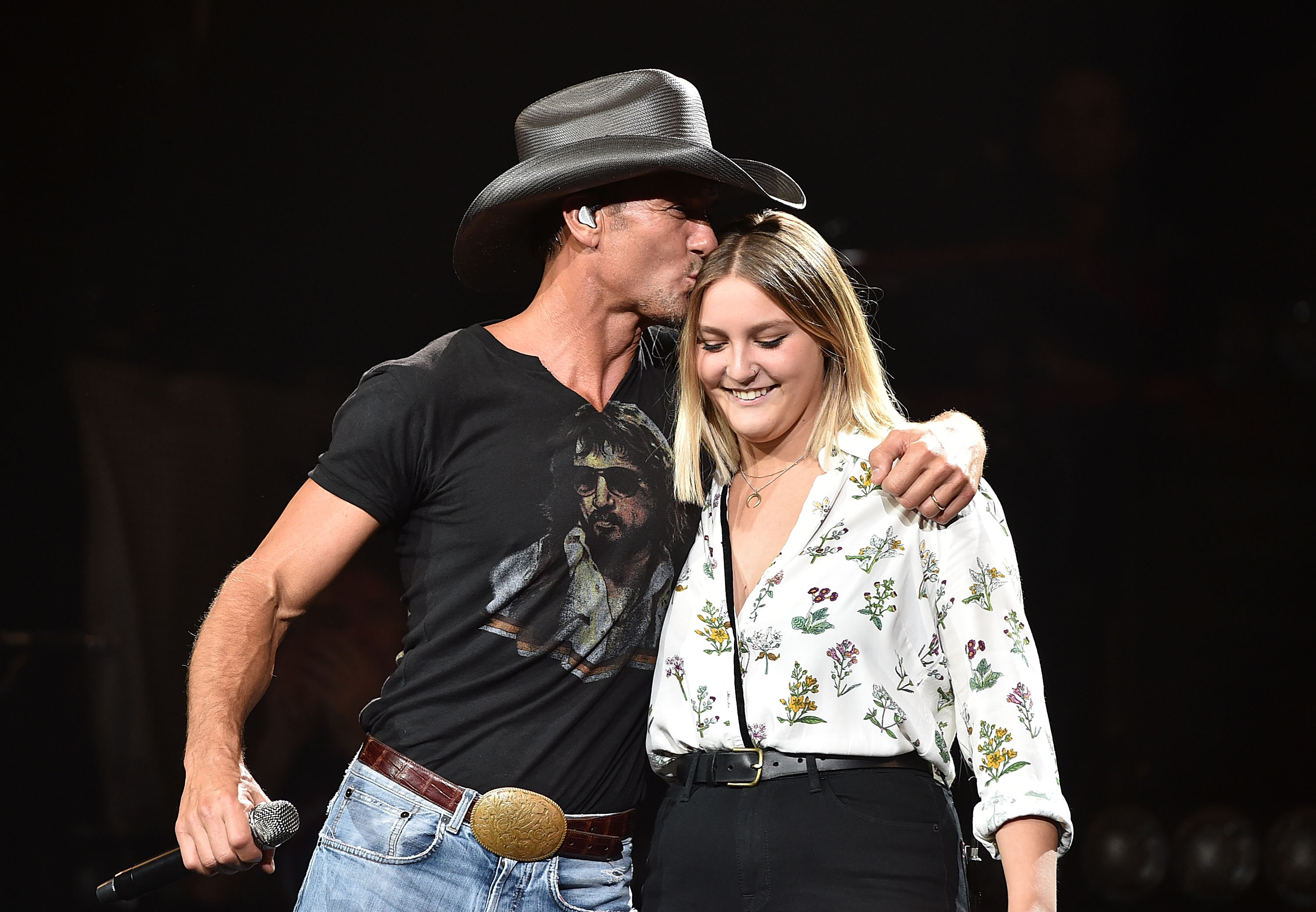 NASHVILLE, TN - AUGUST 15: Musician Tim McGraw, left, performs with his daughter Gracie McGraw on the "Shotgun Rider" tour at Bridgestone Arena on August 15, 2015 in Nashville, Tennessee. 