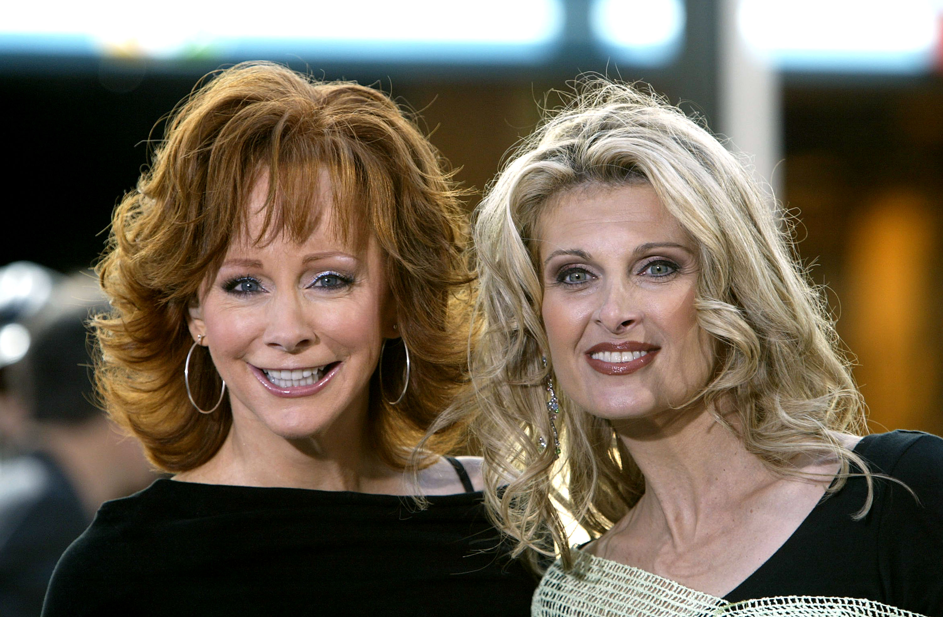 NEW YORK - JUNE 4: Country singer Reba McEntire poses for a photo with her backup singer Linda Davis during a live performance on NBC's "Today" show in Rockefeller Plaza June 4, 2004 in New York City.