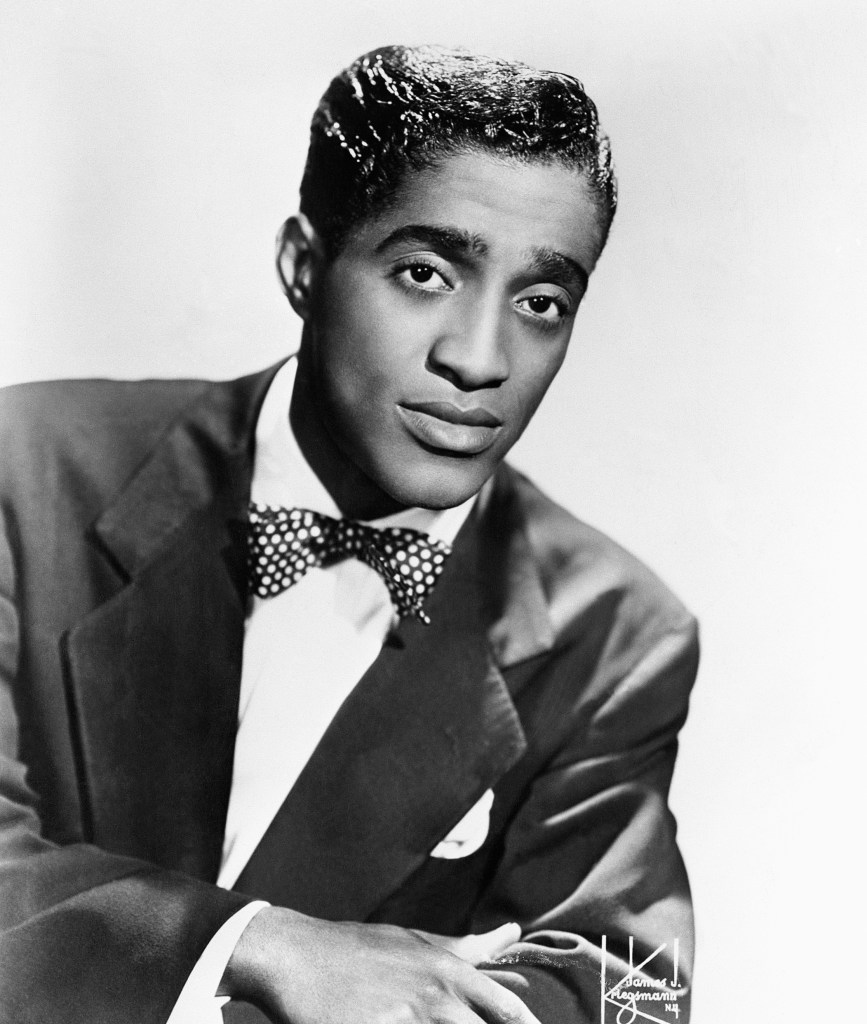 (Original Caption) Portrait of Sammy Davis, Jr., 1925-1990, singer, dancer and actor. 12/22/53 b/w photo.
