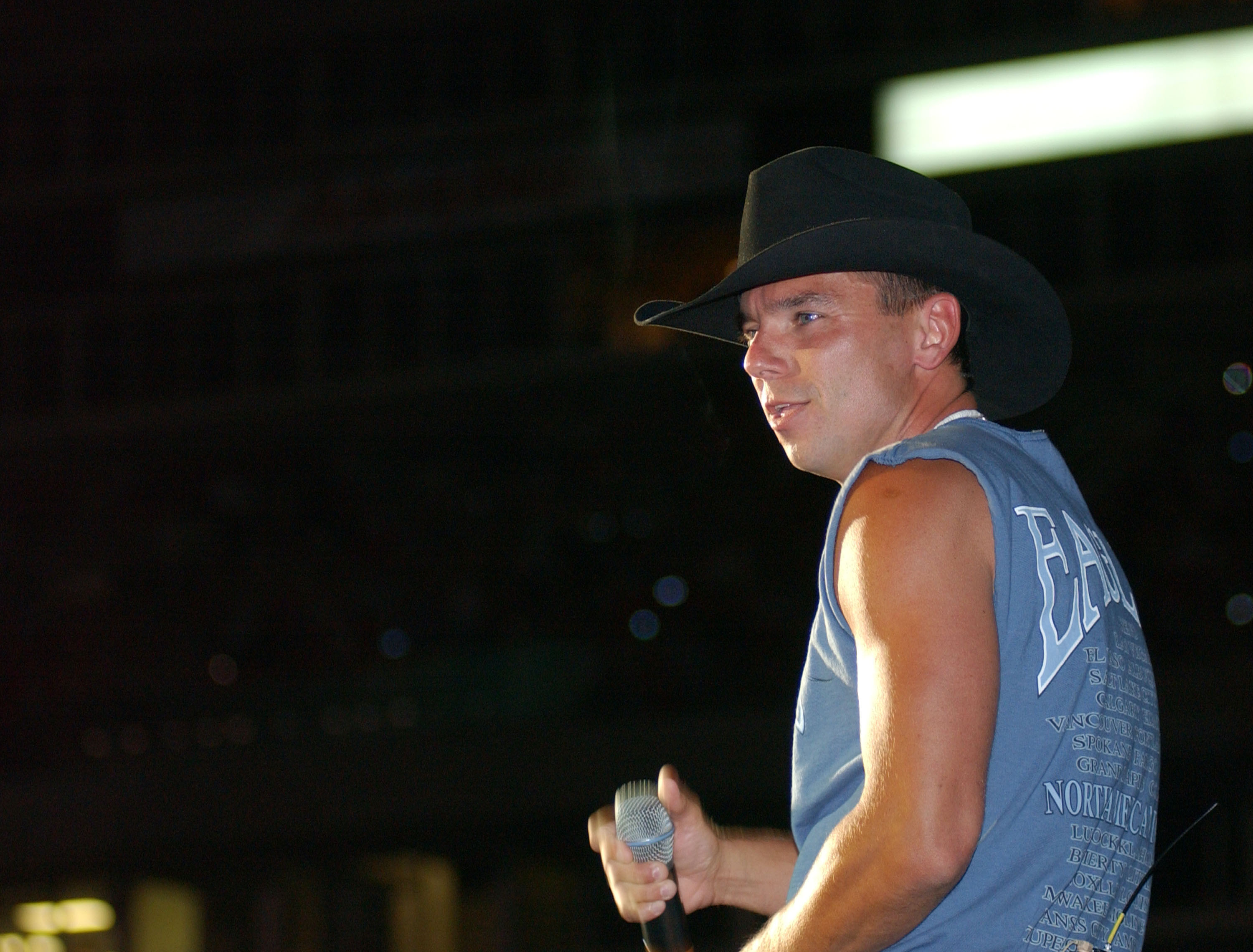NASHVILLE, TN - JUNE 13: Kenny Chesney performs June 13, 2002 at the 31st Annual Fan Fair in Nashville, Tennessee. The four-day event is billed as the world's largest country music festival and features concerts, fan club parties and opportunities to meet the stars. 