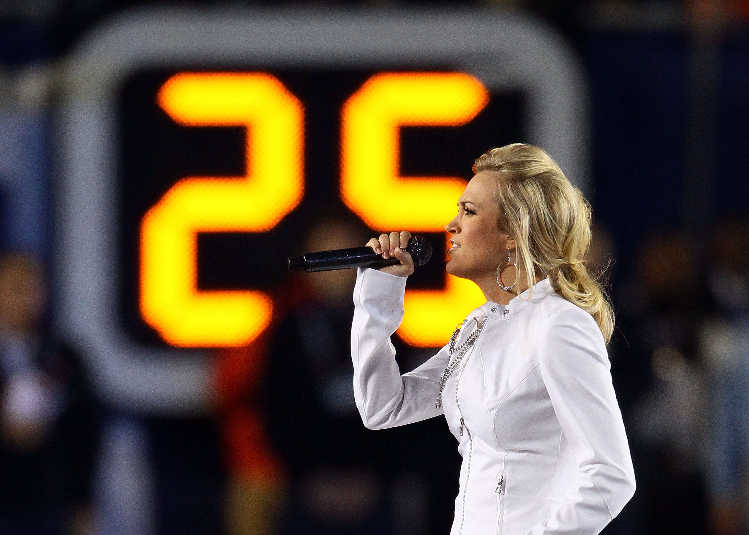 MIAMI GARDENS, FL - FEBRUARY 07: Singer Carrie Underwood performs during the pregame show prior to Super Bowl XLIV between the Indianapolis Colts and the New Orleans Saints on February 7, 2010 at Sun Life Stadium in Miami Gardens, Florida. 