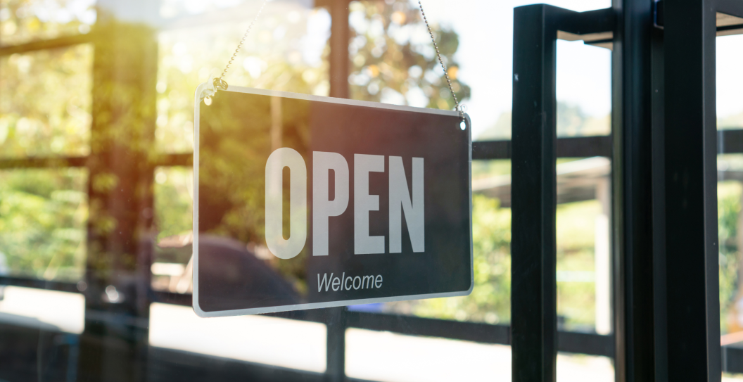 Open sign hanging front of cafe or restaurant. Sign with wording Welcome customer. Business service and food concept.
