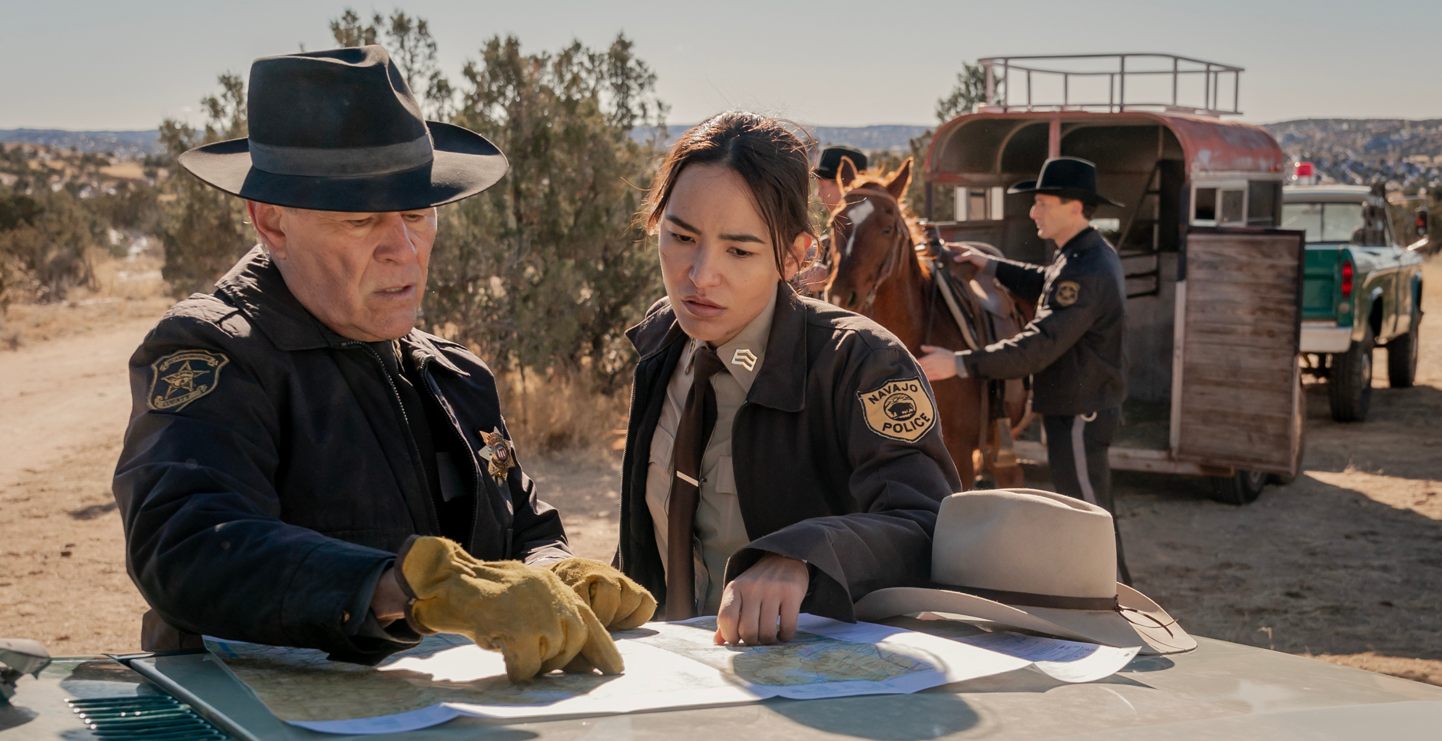 Jessica Matten as Sgt. Bernadette Manuelito and A. Martinez as Gordo Sena - Dark Winds _ Season 2, Episode 4 - Photo Credit: Michael Moriatis/AMC