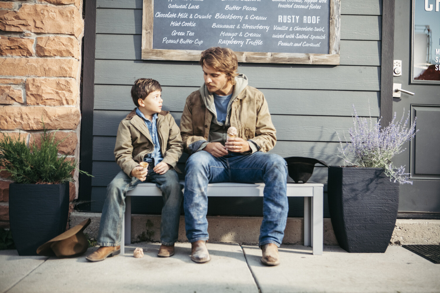 Brecken Merrill as Tate Dutton and Luke Grimes as Kayce Dutton in 'Yellowstone' Season 1, Episode 1