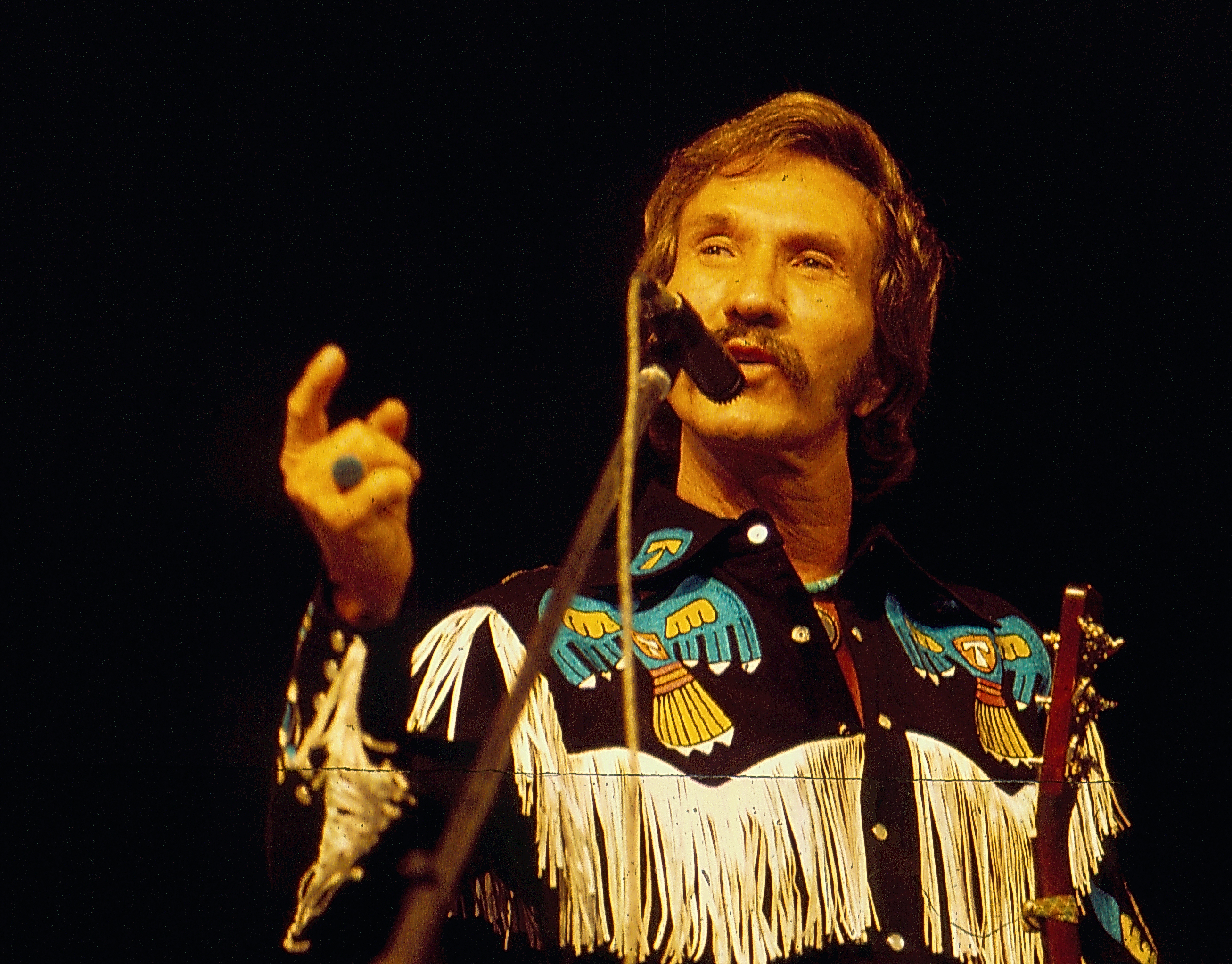 American singer Marty Robbins on stage, 1975.