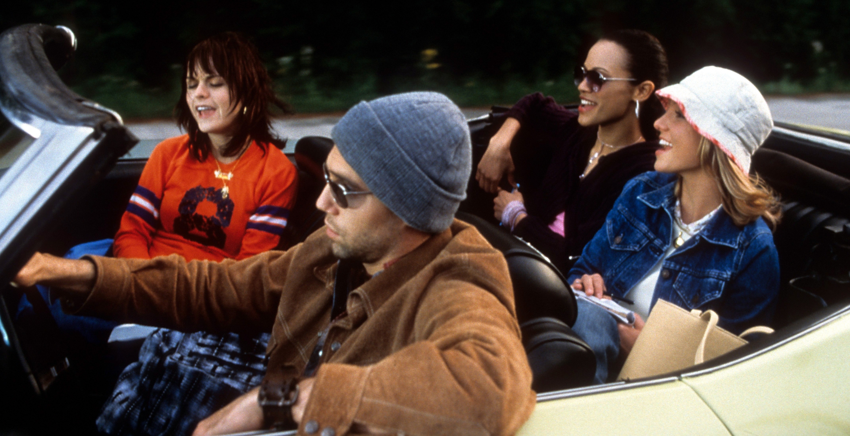Taryn Manning, Anson Mount, Zoe Saldana, and Britney Spears driving in car in a scene from the film 'Crossroads', 2002.
