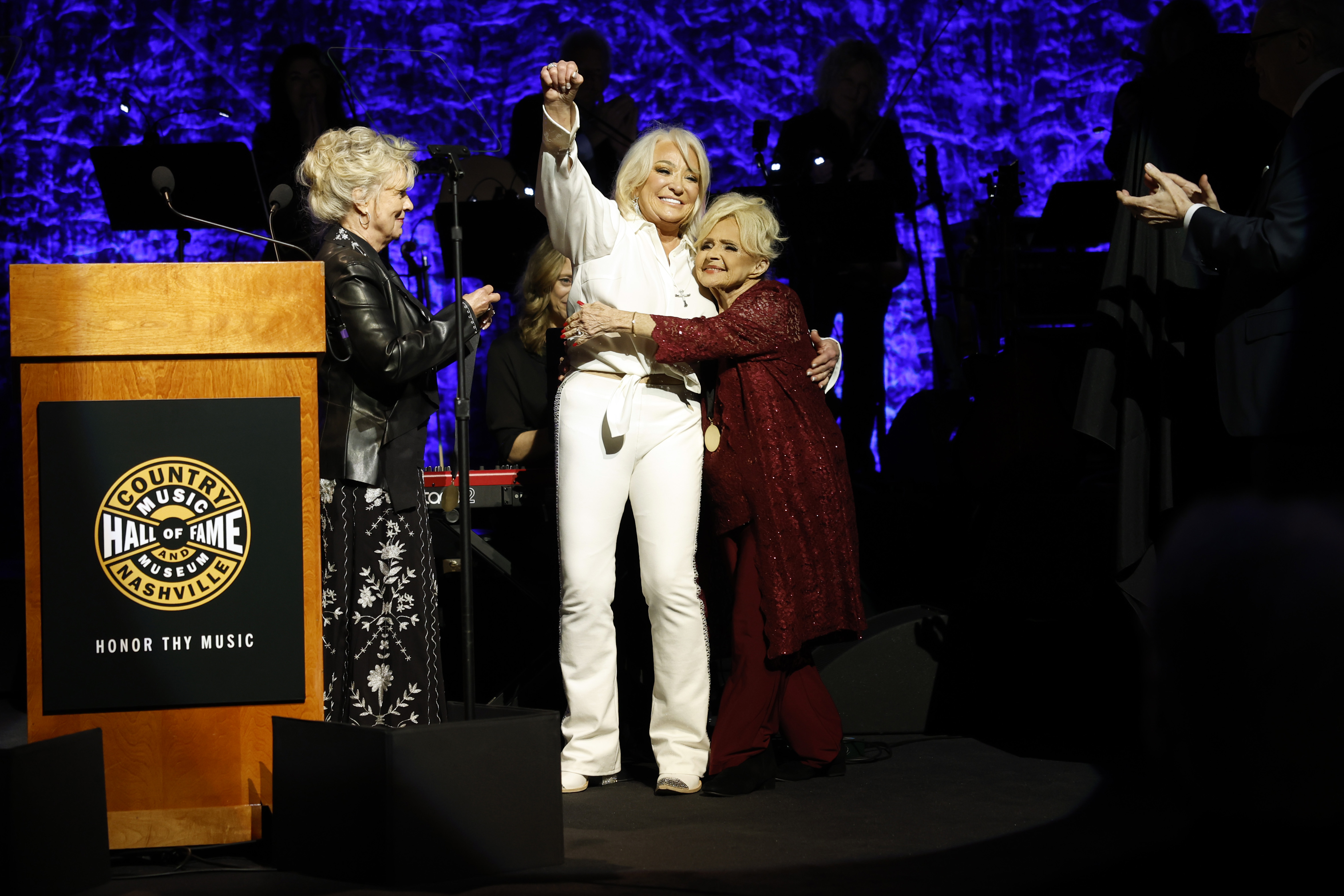 NASHVILLE, TENNESSEE - OCTOBER 22: (EDITORIAL USE ONLY) (L-R) Connie Smith, honoree, Tanya Tucker and Brenda Lee speak onstage during the Class of 2023 Medallion Ceremony at Country Music Hall of Fame and Museum on October 22, 2023 in Nashville, Tennessee