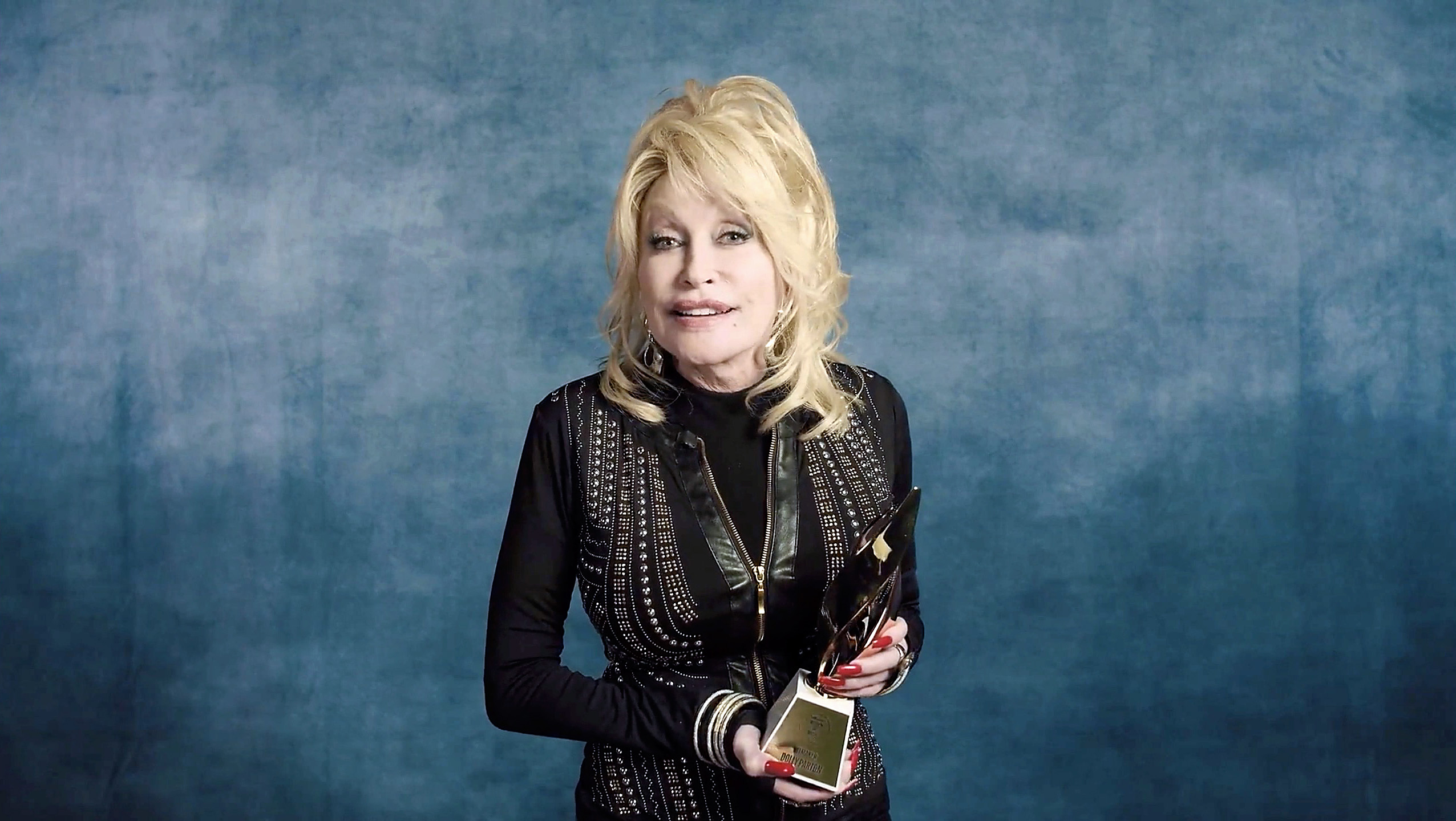 UNSPECIFIED - DECEMBER 10: In this screengrab released on December 10, Dolly Parton accepts the Hitmaker Award during the Billboard Women In Music 2020 event on December 10, 2020. 