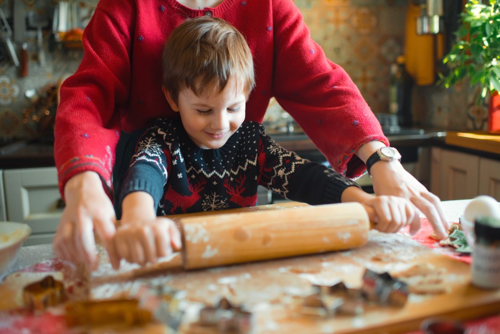 Family enjoying time together at home baking Xmas sweets