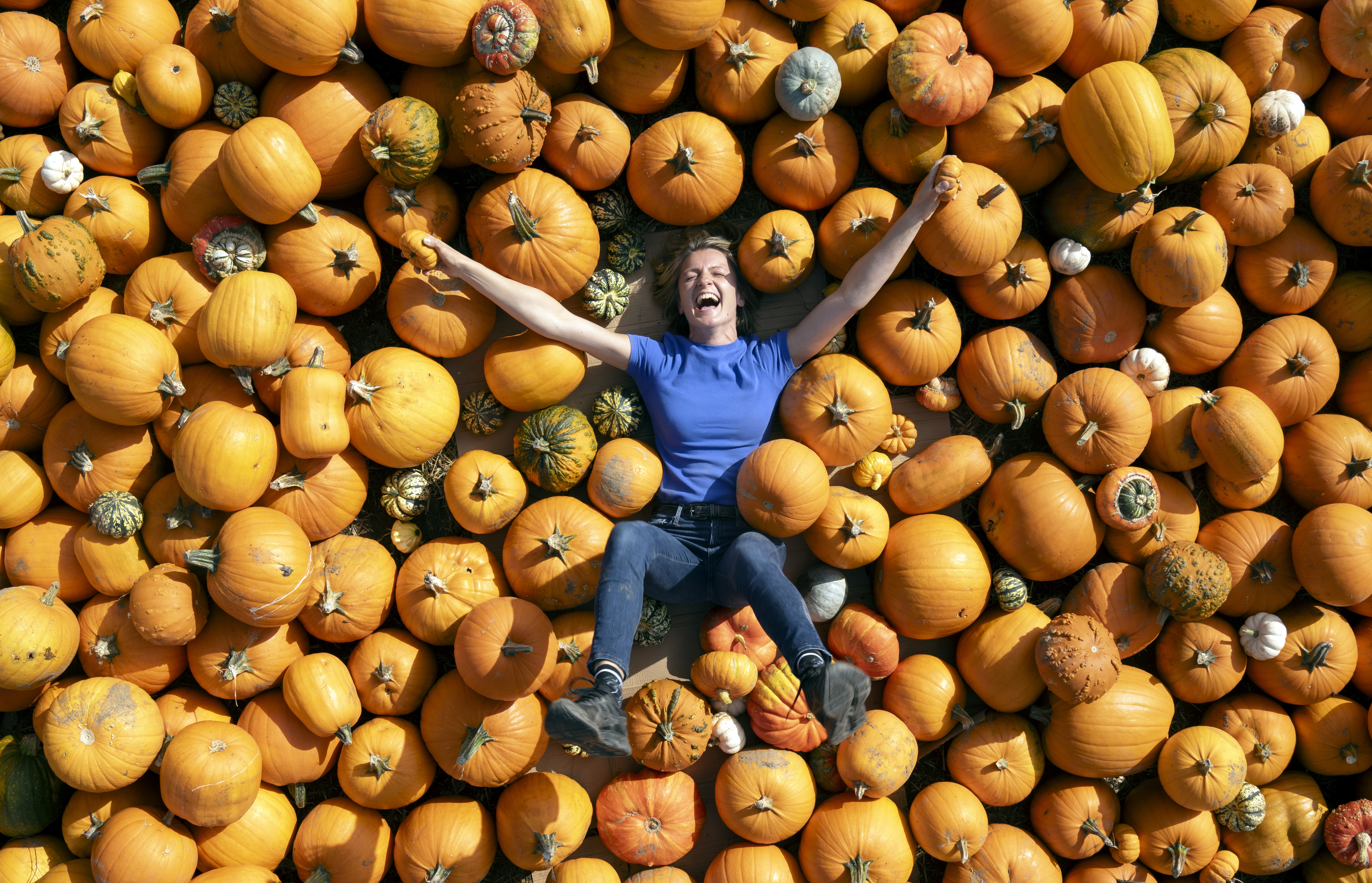 Farmer Dorota Spilman with some of the 125,000 pumpkins at Spilman's Pumpkin Farm in Sessay, near Thirsk, North Yorkshire, ahead of the opening of Pumpkin Fest 2023 on Saturday. Picture date: Monday September 25, 2023. (Photo by Danny Lawson/PA Images via Getty Images)